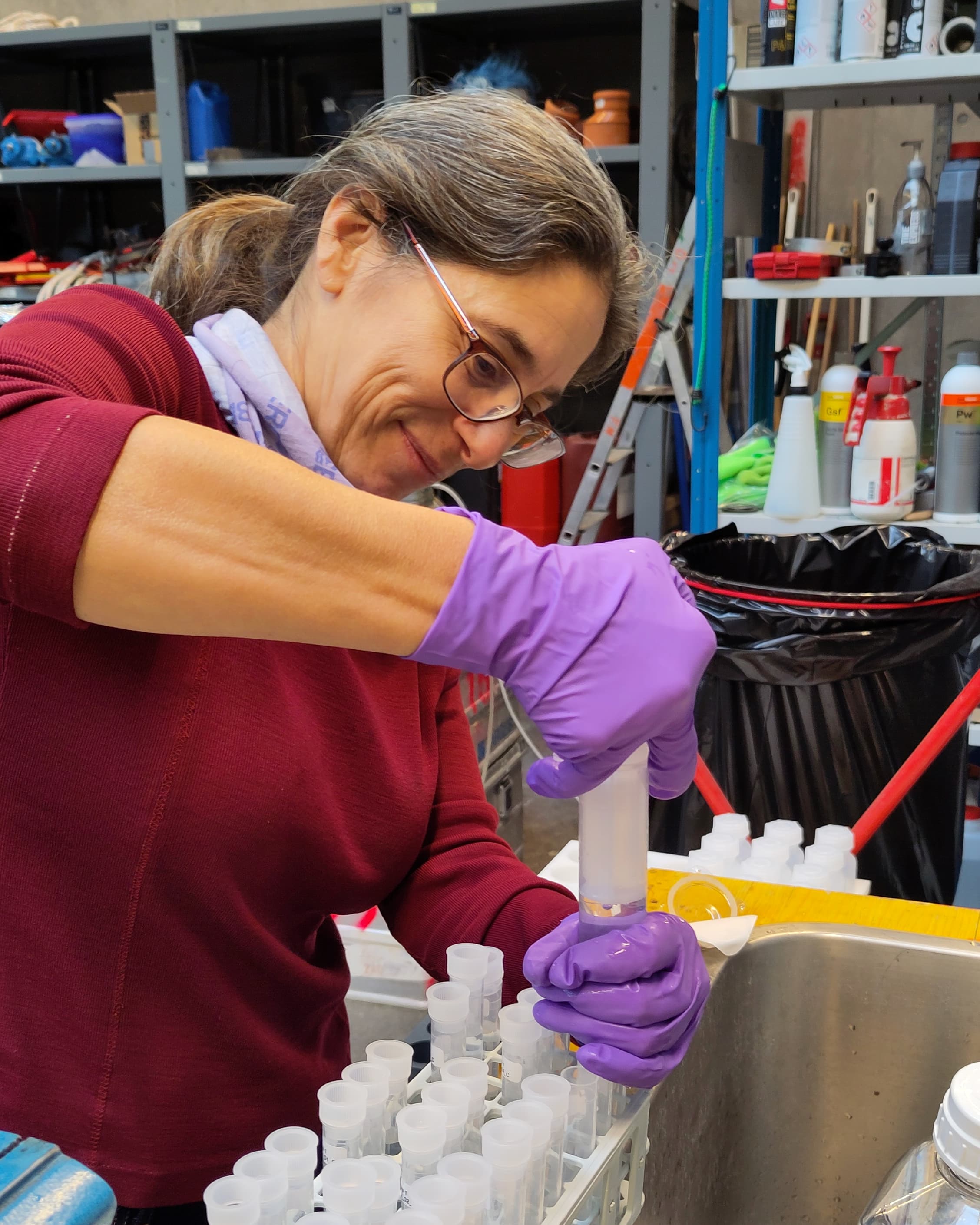 In a laboratory, Christa Marandino inserts water samples into examination tubes.