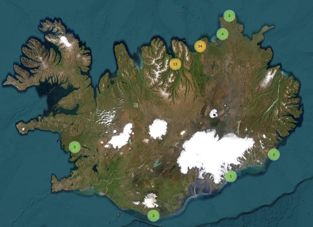 An aerial photo of Iceland. There are yellow and green circles on the eight coastal areas.